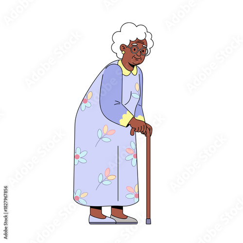 Elderly Black woman standing with cane in colorful floral dress  