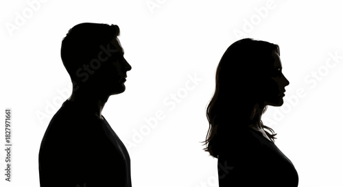 Man and woman profile silhouettes looking in opposite directions.