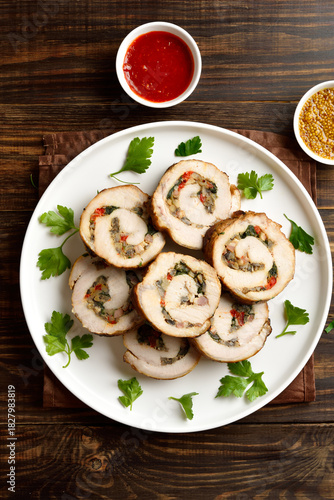 Sliced diet pork roll stuffed with mushroooms, red bell pepper, spinach