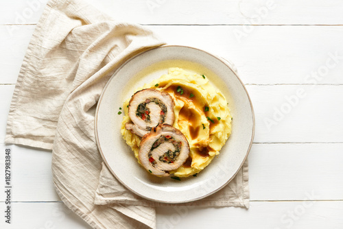 Slices of pork roll with mushrooms, cheese, sun dried tomatoes