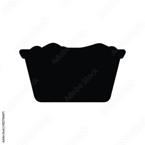 Silhouette of a full laundry basket, ready to be washed and dried