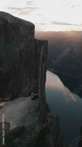 Trolltunga Overlook with Hiker Above Norwegian Fjord