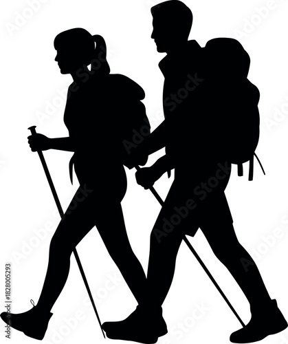 Silhouette of a couple hiking with backpacks and trekking poles