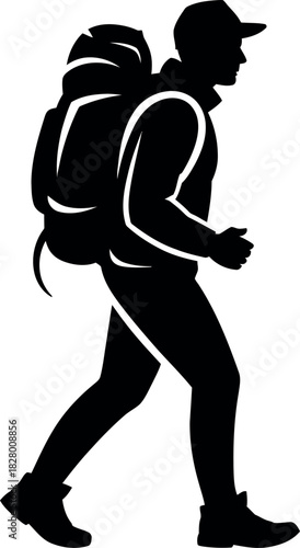 Silhouette of a hiker with a large backpack walking outdoors