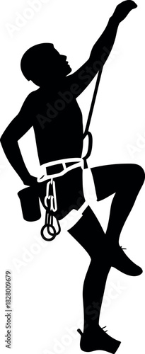 Silhouette of a rock climber ascending a vertical wall