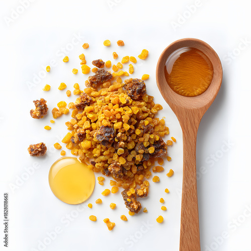 Bee pollen and propolis granules with honey in wooden spoon, isolated on white background, natural superfood and apitherapy product