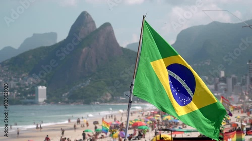 Slow motion shot of the Brazilian flag waving in the wind on Ipanema Beach in Rio de Janeiro, Brazil.