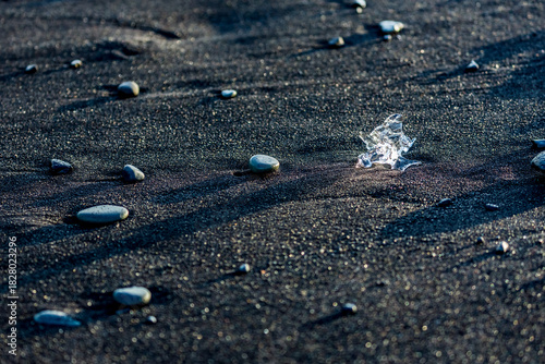 Scenery black sandy beach view near Jökulsárlón, glacier lake in Southern Iceland. Tourist and travel European destination on the island.