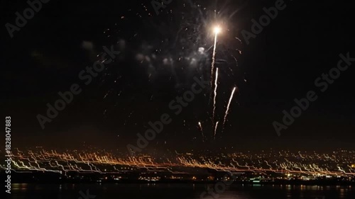 Colorful fireworks display over the night sky with city lights for festive celebrations