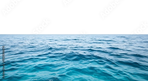 Blue Ocean Water Surface With Gentle Waves And White Sky