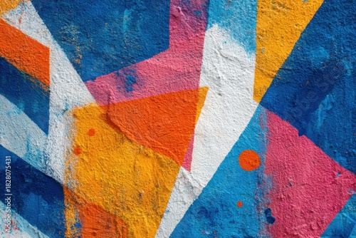 Vibrant abstract urban wall graffiti creating a colorful street art scene in a bustling city environment during daytime