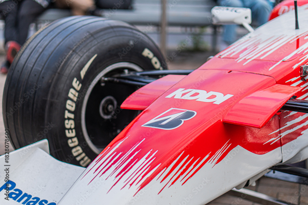 Fototapeta premium Formula 1 Toyota TF-108 car at a race track, predominantly red and white with sponsor logos Kaspersky, Panasonic, Pirelli racing slicks, aerodynamic design, coolin - Kyiv, Ukraine 10-10-2024