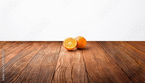 Wooden Surface With Orange Against A White Backdrop
