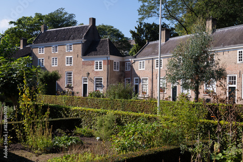 Beguinage with 29 houses around a herb garden in the historic city of Breda in the Netherlands.