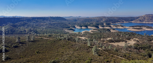 New Melones Lake is a reservoir on the Stanislaus River in the central Sierra Nevada foothills, within Calaveras County and Tuolumne County, California