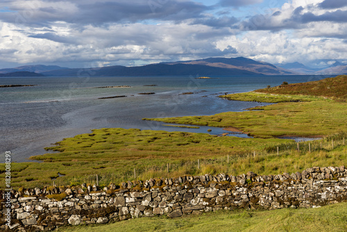 The breath-taking panoramic view of Ashaig Beach - a serene hidden gem located near the township of Breakish on the south-east coast of the Isle of Skye. It is best known for its shallow rock pools.