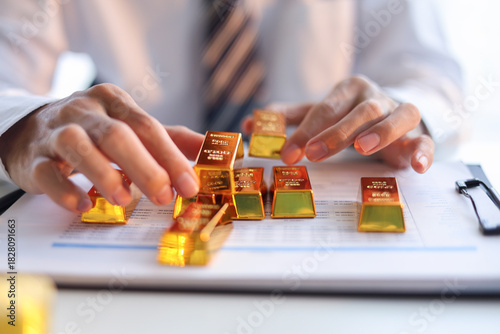 Fotografie Businessman investing in gold to diversify portfolios hedge against inflation and currency depreciation