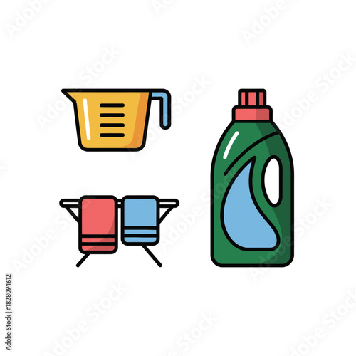 A measuring cup, towels, and a bottle of laundry detergent are arranged for washing clothes.