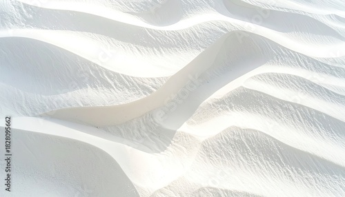 Fototapeta Naklejka Na Ścianę i Meble -  Textured waves of pristine white sand dunes bathed in sunlight