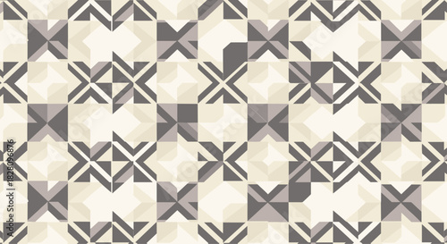 Abstract geometric seamless pattern with a complex arrangement of grey and beige shapes creating a modern quilt-like texture.