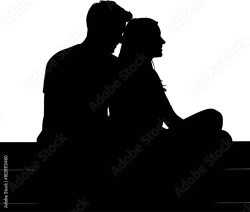Silhouetted couple in intimate embrace, sitting together closely