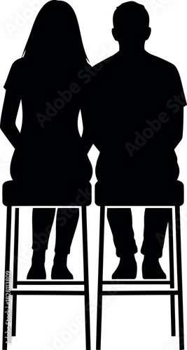 Silhouette of a man and woman sitting on bar stools, back view