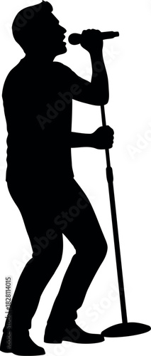 Male singer silhouette performing live with microphone on stand