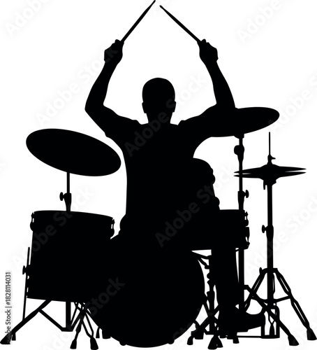 Energetic drummer silhouette playing drum kit, sticks in the air