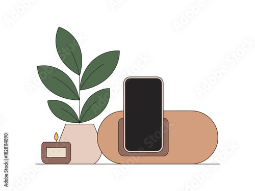 A smartphone rests on a minimalist charging stand next to a potted plant and a lit candle.