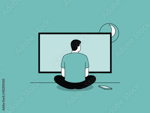 A person sits cross-legged on the floor watching a large screen at night.