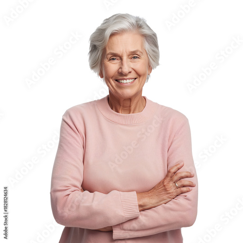Smiling Older Woman Poses With Arms Crossed in a Light Pink Sweater Against a...
