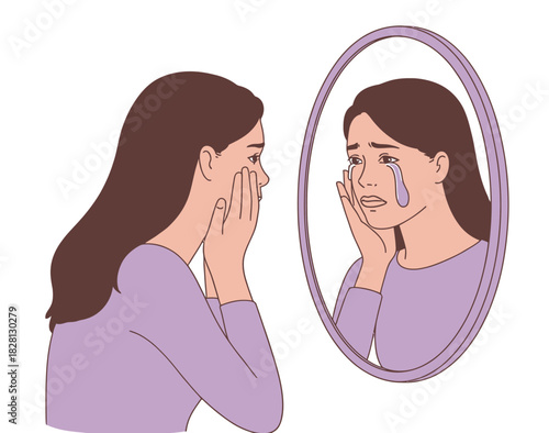 A young woman cries as she looks at her reflection in a mirror, expressing sadness.