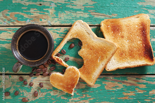 Coffee and toast with a heart-shaped cutout