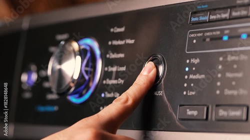 Pressing the start button on washing machine 2