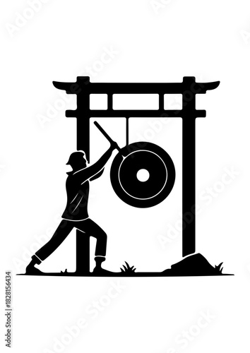 Person Striking a Gong under a Torii Gate Silhouette