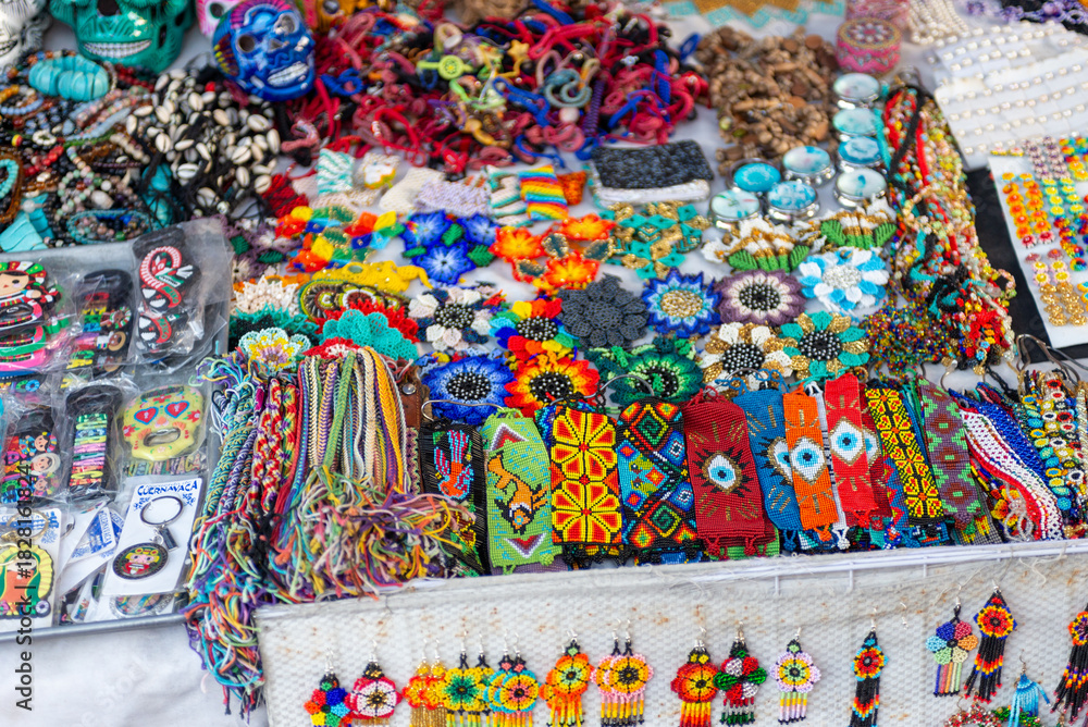 Fototapeta premium Accessories made with multicolored chaquira. Mexican handicrafts made with colorful stones.