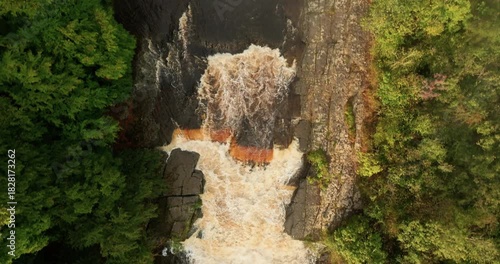 Top down shot of a waterfall in full spate