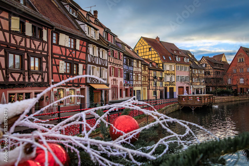 Fototapeta Naklejka Na Ścianę i Meble -  Festive decorations on half timbered houses, Colmar Christmas Market in France