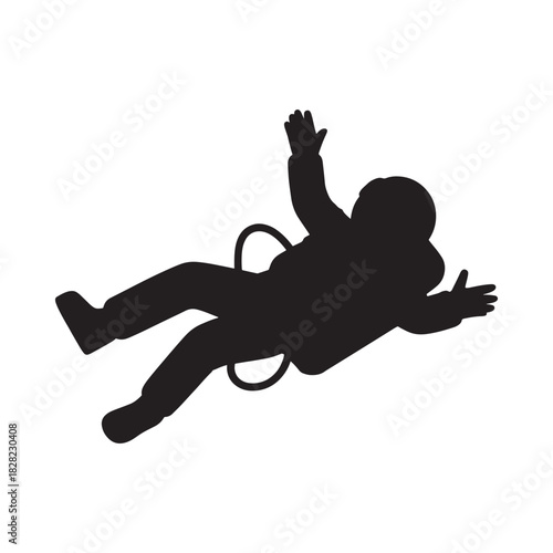 Silhouette of a person falling with arms outstretched