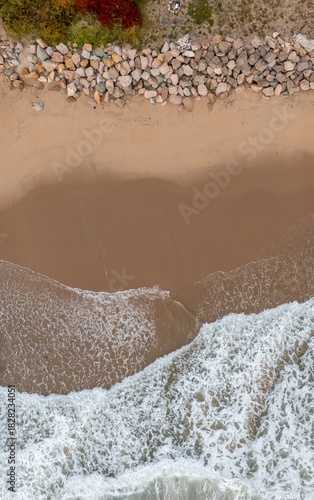 Top view of Ingonish Beach along Cabot Trail, Cape Breton, Nova Scotia, Canada. Incredible blue ocean waters with  the autumn fall foliage colors. 