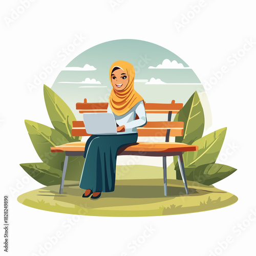 Woman with hijab working on laptop in park.