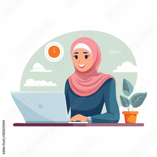 Female Muslim woman in hijab working on laptop at desk.