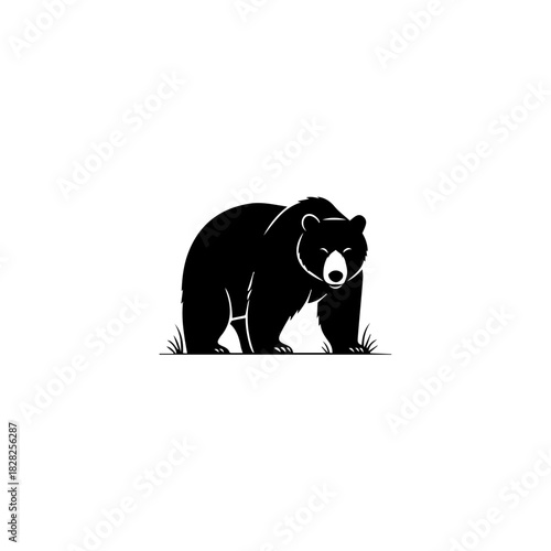 Bold black silhouette of a powerful wild bear standing in a natural pose
