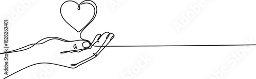 Human hand holding heart symbol