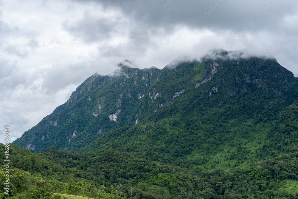 Obraz premium Majestic Doi Luang Chiang Dao mountain viewed from Ban Ruang Dao village in Chiang Dao district, Chiang Mai Province, Thailand.