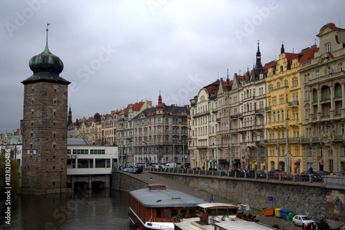 Prague Vltava river embankment with tower and historic facades, May, 2010