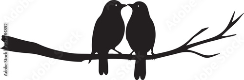 Two black birds perched on a tree branch silhouette