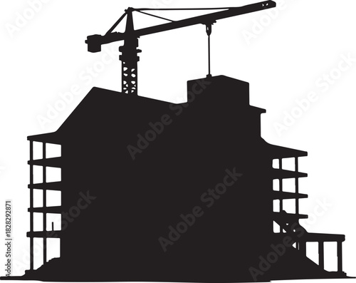Black silhouette of building under construction with crane