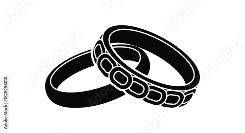 Interlocked wedding rings symbolizing commitment and love in silhouette