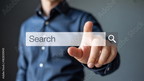A man is pointing at a search bar with the word search written on it